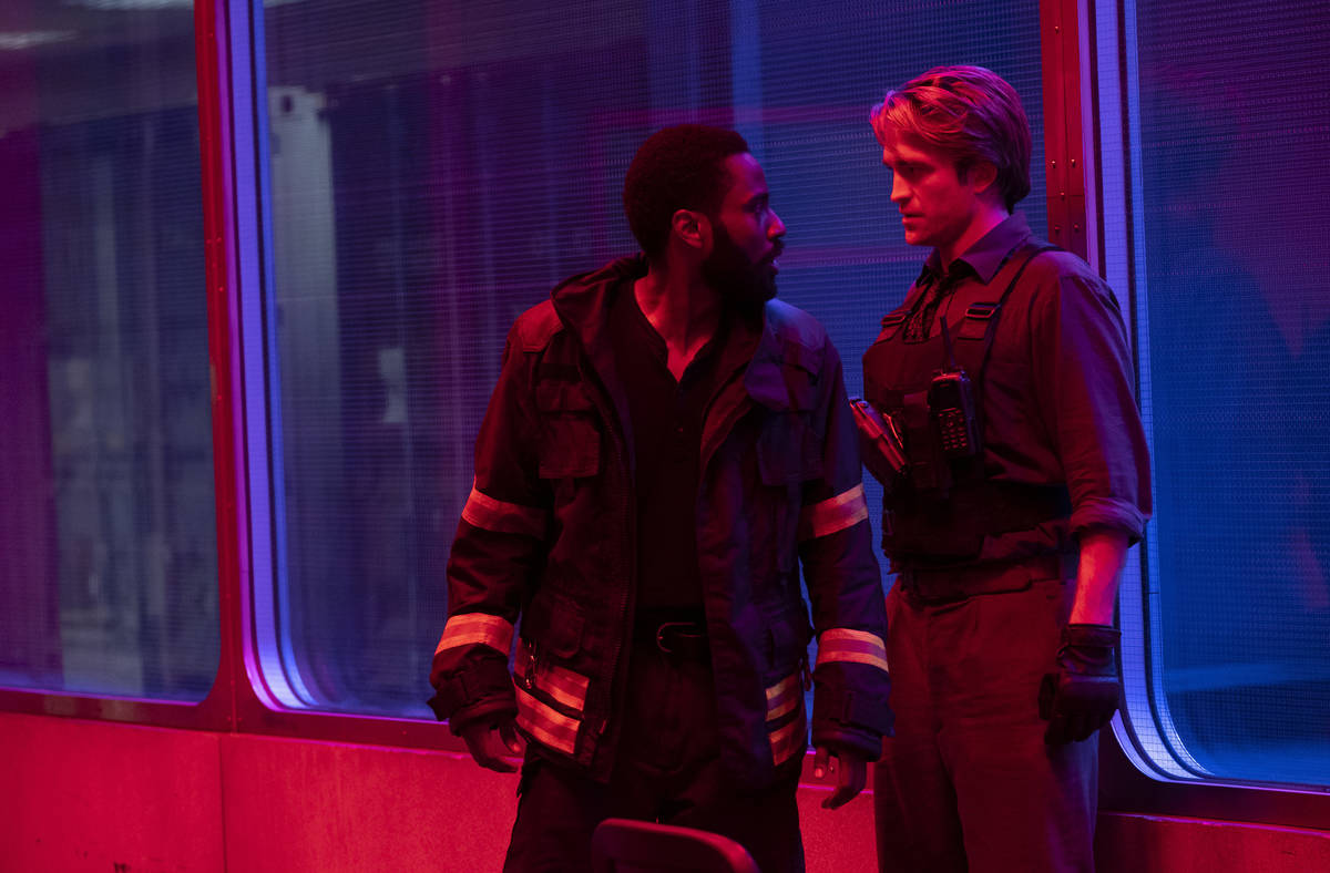 JOHN DAVID WASHINGTON, left, and ROBERT PATTINSON star in "TENET." (Melinda Sue Gordon/Warner B ...