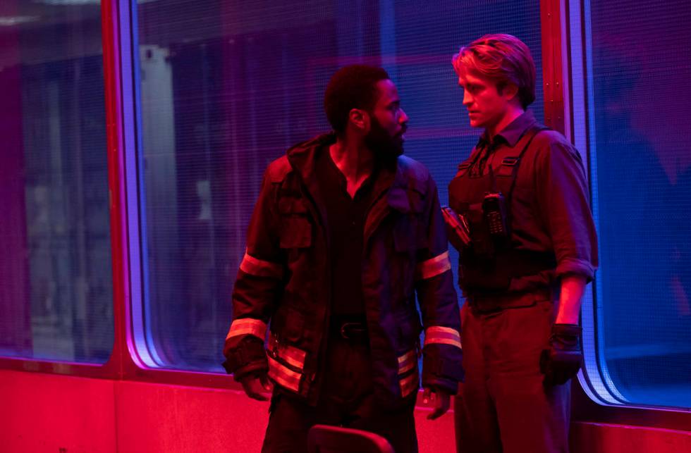 JOHN DAVID WASHINGTON, left, and ROBERT PATTINSON star in "TENET." (Melinda Sue Gordon/Warner B ...