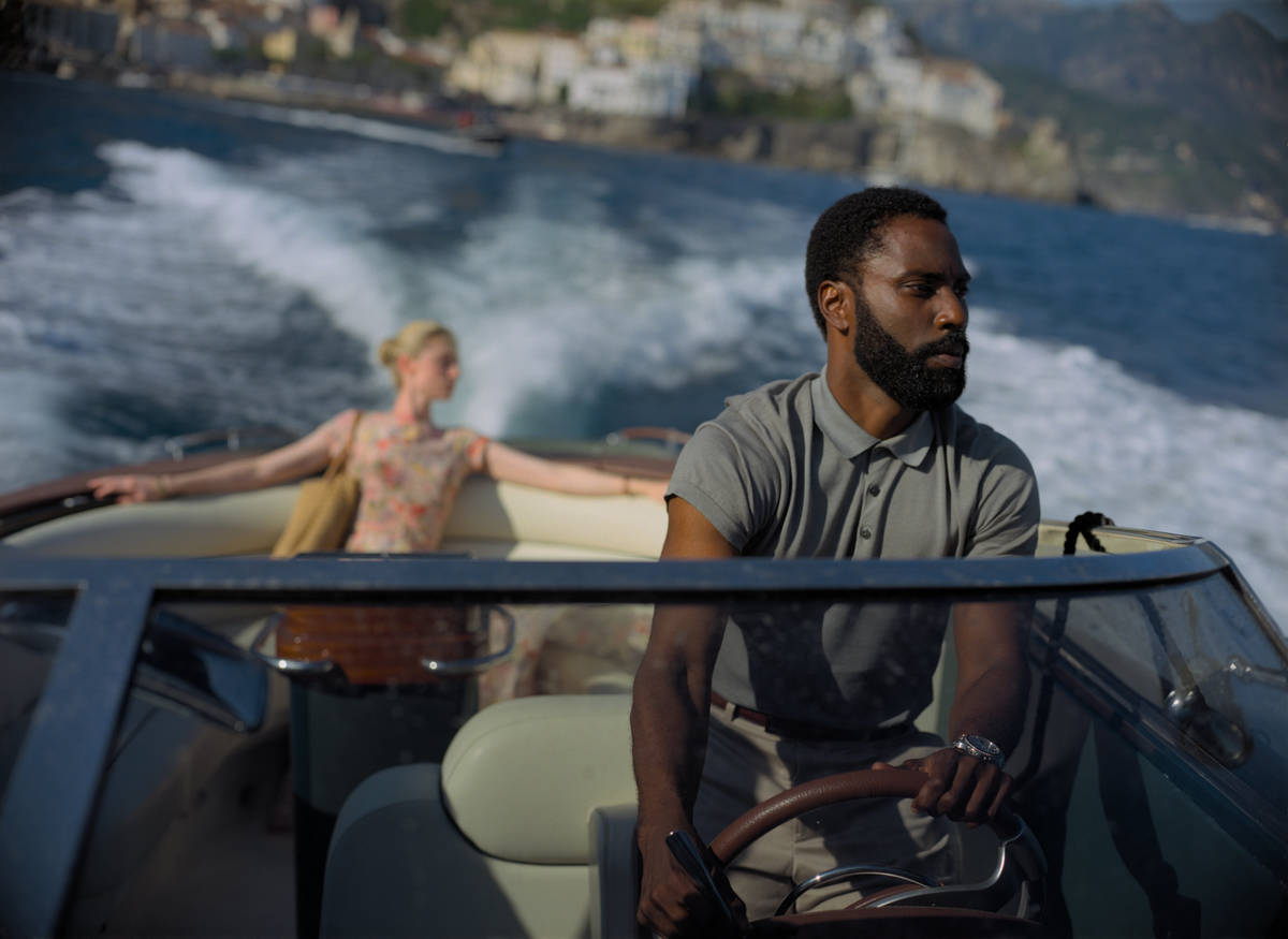 ELIZABETH DEBICKI and JOHN DAVID WASHINGTON star in "TENET." (Warner Bros. Entertainment)