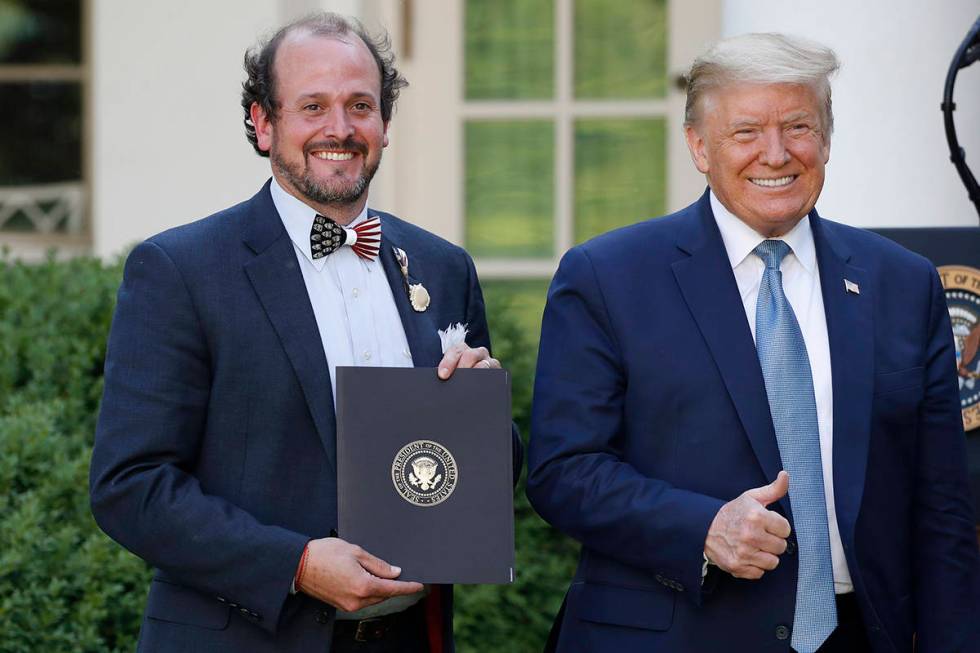 President Donald Trump poses for a photo with Ben Ross during a presidential recognition ceremo ...