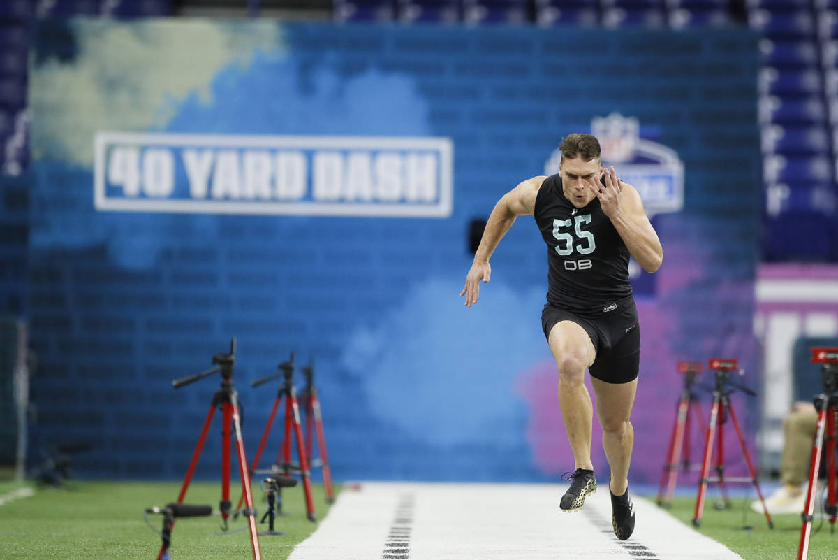 Clemson defensive back Tanner Muse runs the 40-yard dash at the NFL football scouting combine i ...