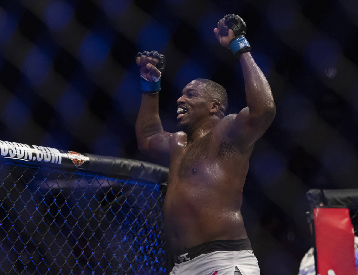 Walt Harris celebrates after defeating Andrei Arlovski in a heavyweight mixed martial arts bout ...