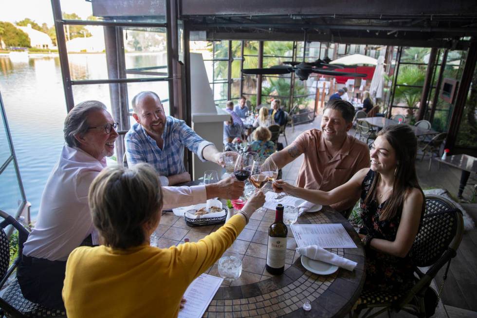 Cliff Miller, left, Rusty Miller, Michael Craigwood and Miranda Beckum raise their wine glasses ...