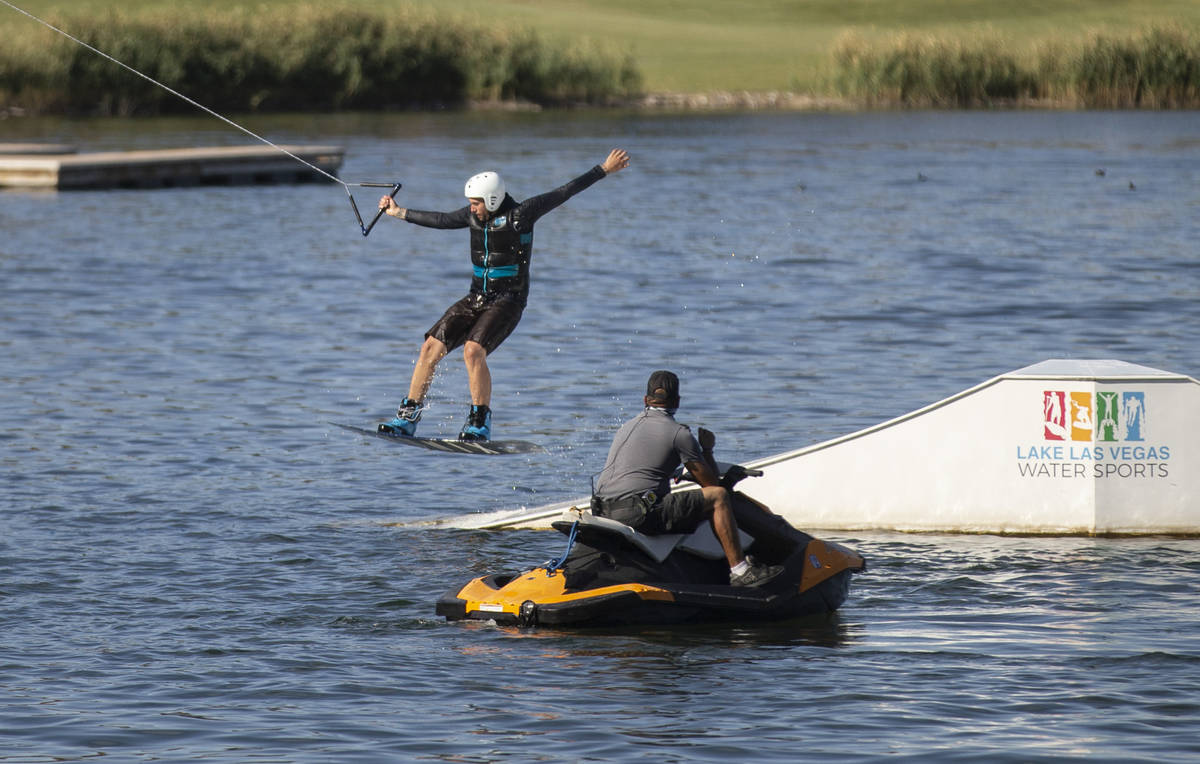 Jash Metz, with Lake Las Vegas Water Sports, wakeboards with a weight cable on Friday, May 15, ...