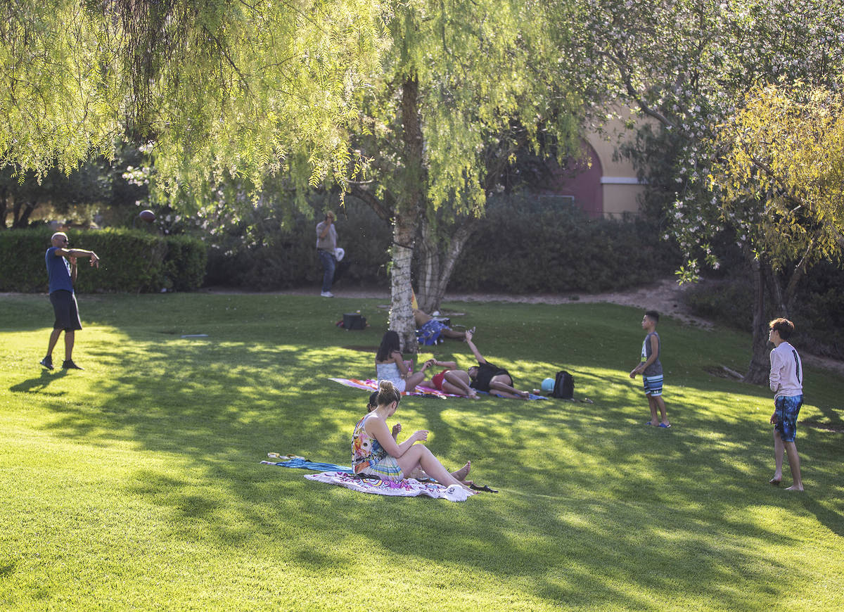People relax outside at Lake Las Vegas on Friday, May 15, 2020, in Henderson. (Benjamin Hager/L ...