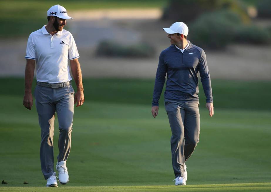 FILE - In this Jan. 18, 2018, file photo, Dustin Johnson of the United States, left, and Rory M ...