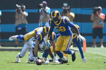 Carolina Panthers wide receiver D.J. Moore fumbles while Los Angeles Rams inside linebacker Cor ...