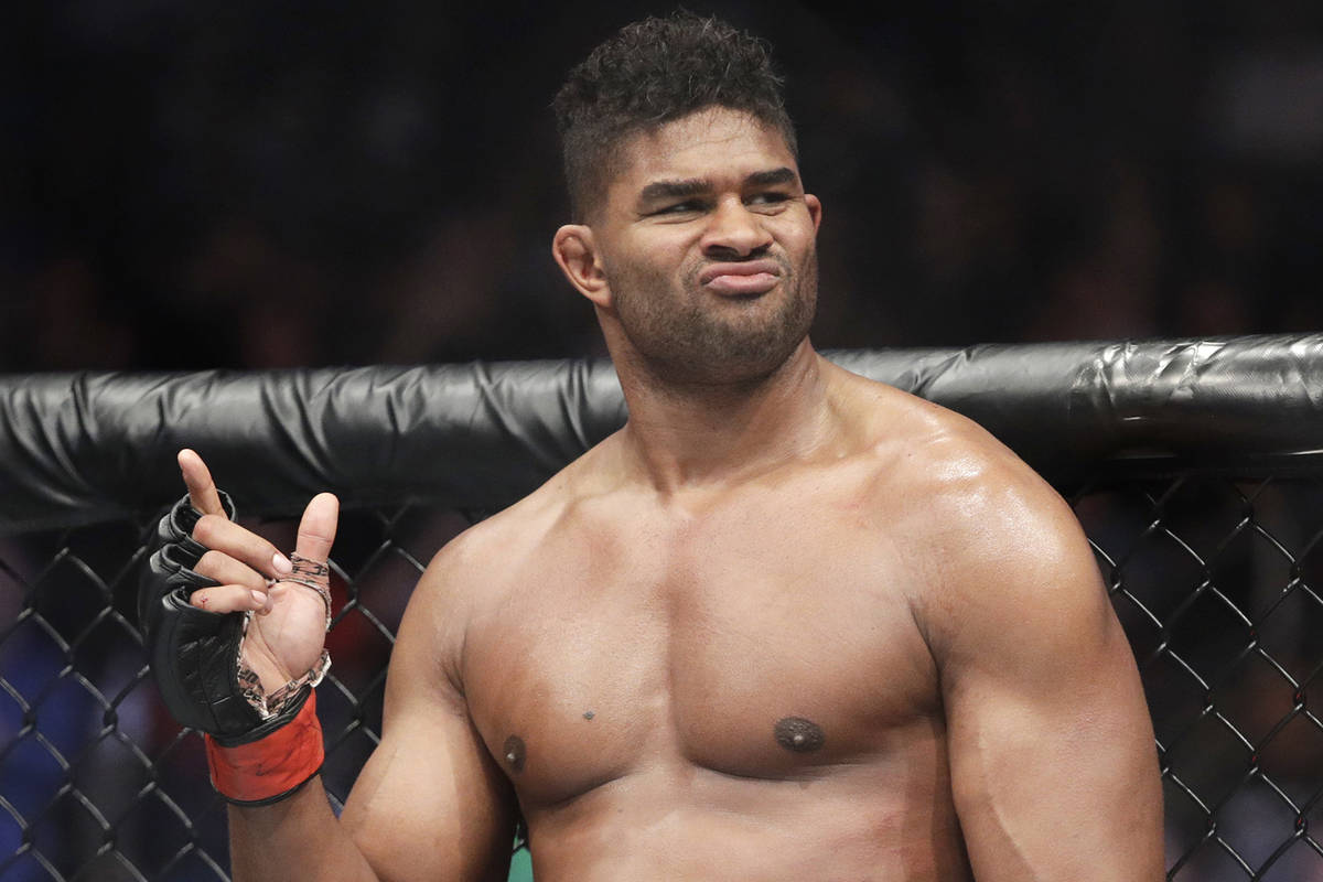 Alistair Overeem celebrates after defeating Mark Hunt during a heavyweight mixed martial arts b ...