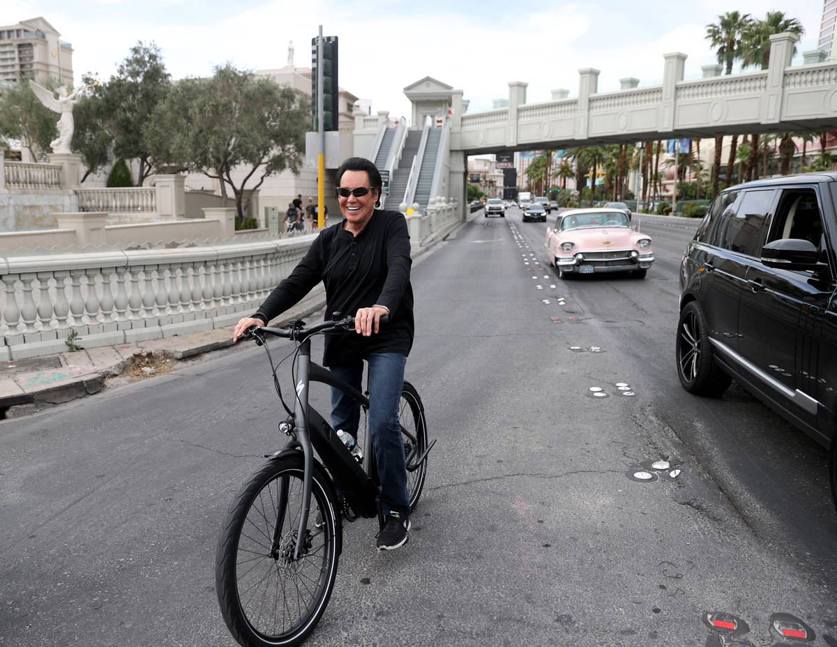 Mr. Las Vegas Wayne Newton rides a bicycle on the Strip in Las Vegas Saturday, May 16, 2020. (K ...