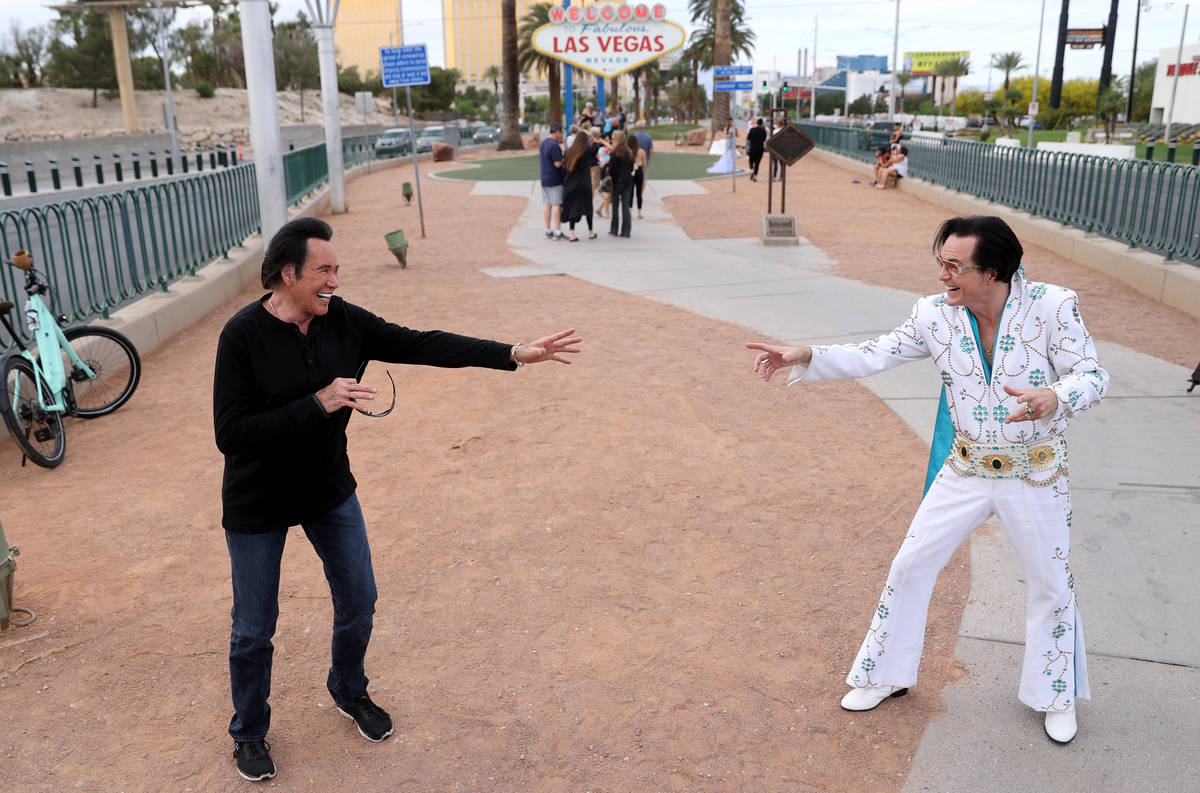 Mr. Las Vegas Wayne Newton, left, keeps social distance from Eddie Powers as Elvis at the Welco ...