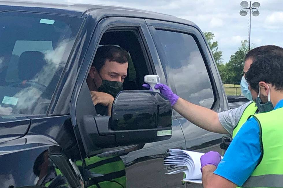 Driver Ryan Newman gets his temperature taken as he arrives at Darlington Raceway before the Re ...