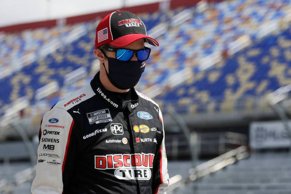 Driver Brad Keselowski walks to his car for the start of the NASCAR Cup Series auto race Sunday ...