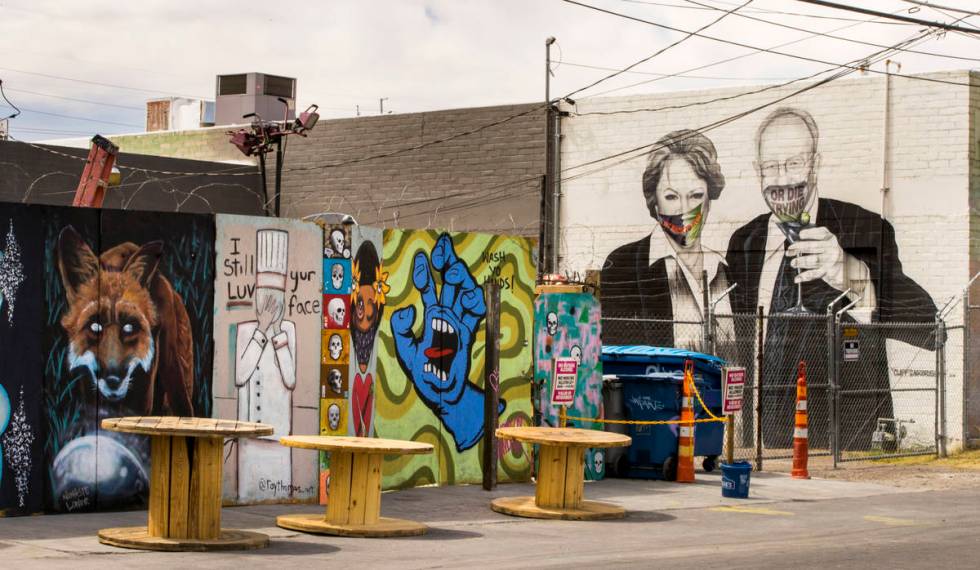 Mayor Carolyn Goodman and husband Oscar are portrayed in a mural now wearing face masks along a ...