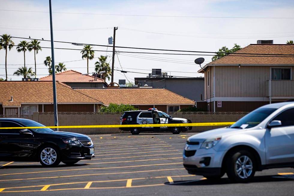 Las Vegas police investigate the scene of a shooting at Tropicana Avenue and Maryland Parkway i ...