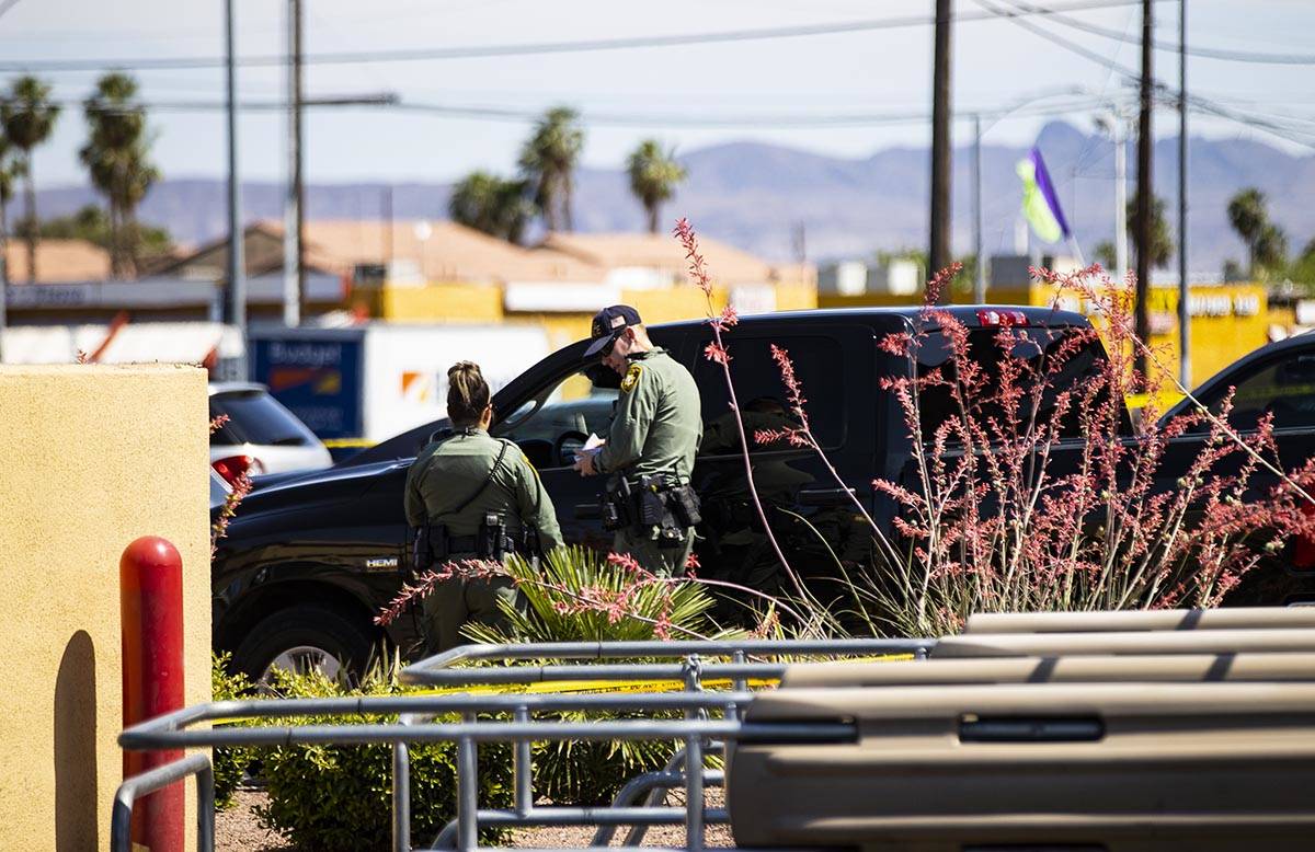 Las Vegas police investigate the scene of a shooting at Tropicana Avenue and Maryland Parkway i ...