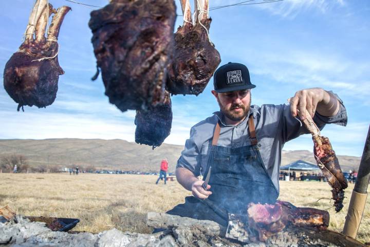 Chef Justin Kingsley Hall, with The Kitchen at Atomic, prepares cape grim tomahawk steaks durin ...