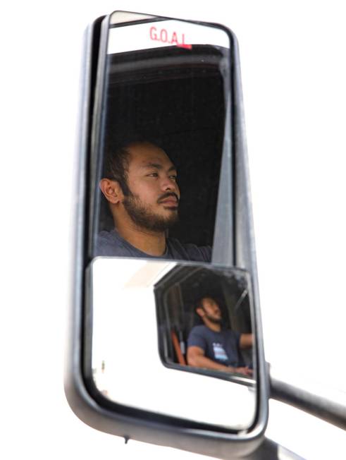 Kim Santiago, an over-the-road truck driver, in his truck at his home in Las Vegas on Sunday, M ...