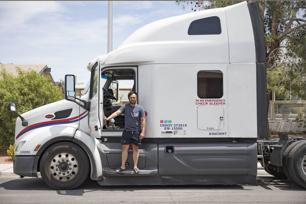 Kim Santiago, an over-the-road truck driver, outside his truck at his home in Las Vegas on Sund ...