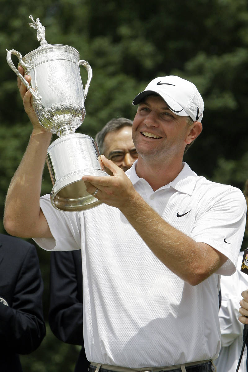 FILE - In this June 22, 2009, file photo, Lucas Glover holds his trophy after winning the U.S. ...