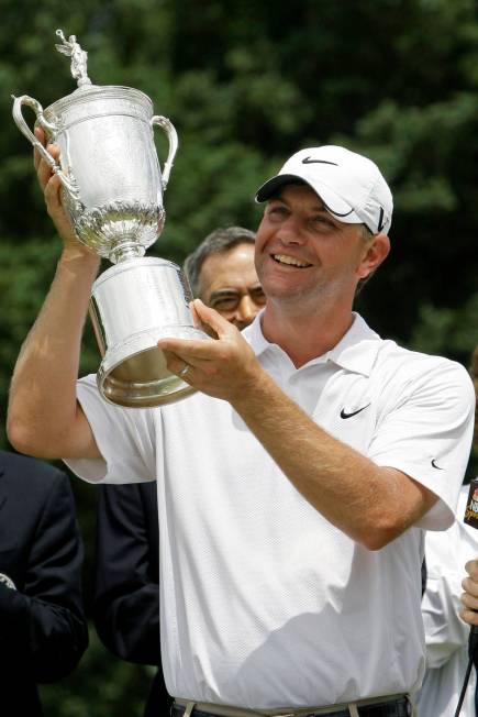 FILE - In this June 22, 2009, file photo, Lucas Glover holds his trophy after winning the U.S. ...