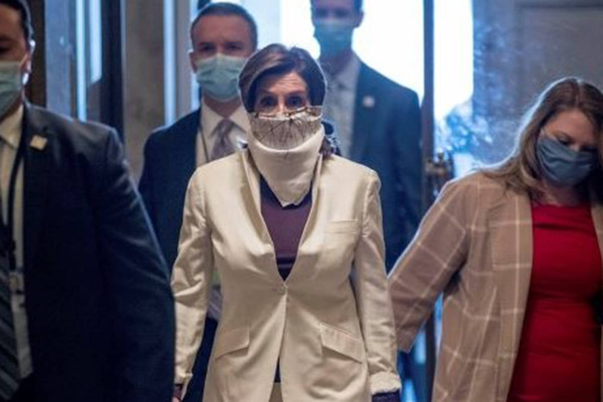 House Speaker Nancy Pelosi of California walks on Capitol Hill, Thursday, April 23, 2020, in Wa ...