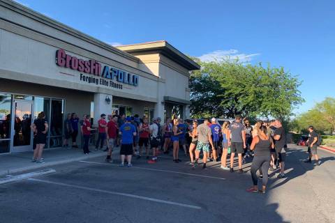 A large group gathered Monday, May 18, 2020, outside CrossFit Apollo in the northwest valley. ( ...