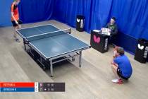 Evgeniy Ilyukhin (in blue) reacts after missing a shot against Aleksandr Petrov in a Moscow Lig ...