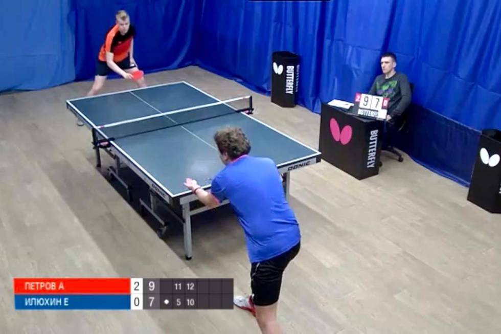 Evgeniy Ilyukhin (in blue) faces off against Aleksandr Petrov in a Moscow Ligo Pro table tennis ...