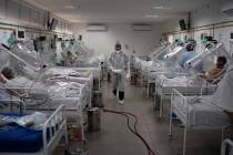 COVID-19 patients are treated inside a non-invasive ventilation system named the 'Vanessa Capsu ...