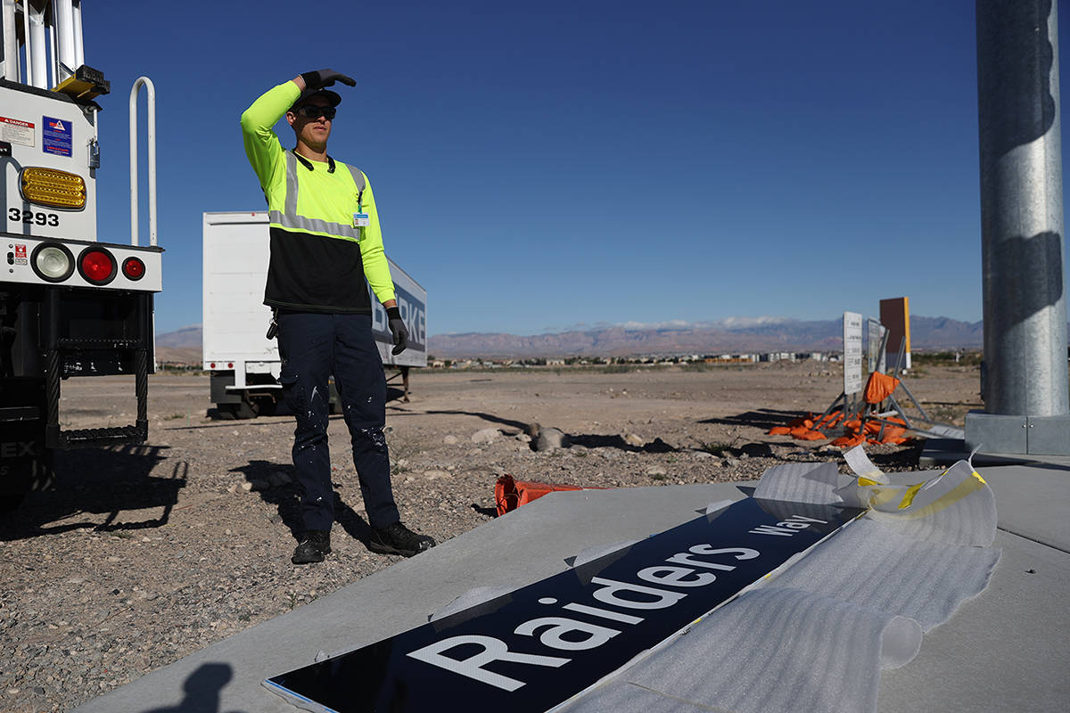 Justin Buhl, traffic signal technician for the city of Henderson, gets ready to install a Raide ...