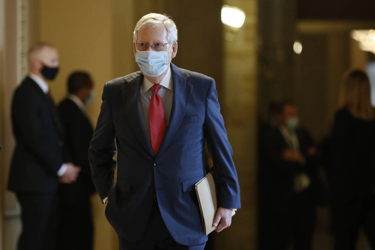 Senate Majority Leader Mitch McConnell of Ky., wears a face mask to protect against the spread ...