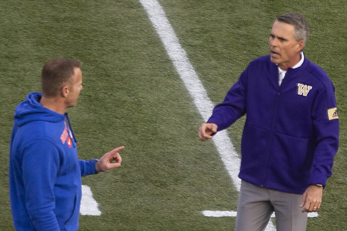 Boise State Broncos head coach Bryan Harsin and Washington Huskies head coach Chris Petersen ch ...