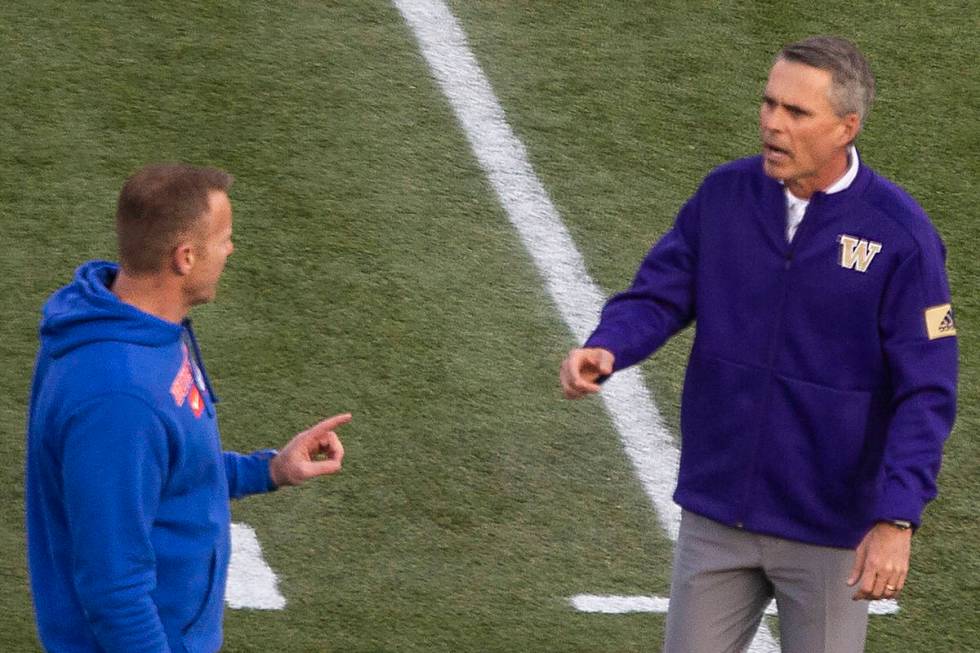 Boise State Broncos head coach Bryan Harsin and Washington Huskies head coach Chris Petersen ch ...