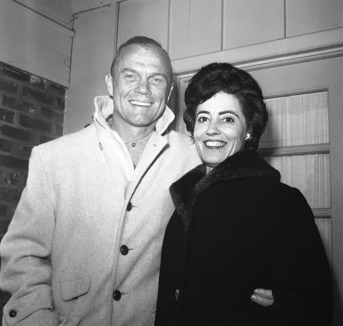 In this Feb. 3, 1962 file photo, astronaut John Glenn poses with his wife, Annie, outside thei ...