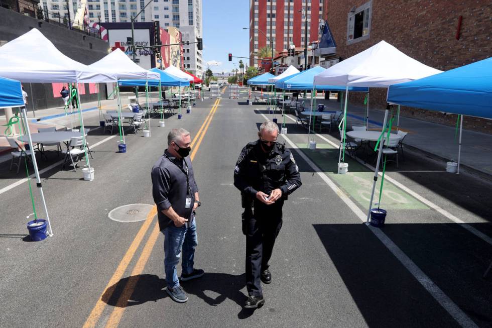 Steven Lumpkin, with the City of Las Vegas City Marshals department, left, and Deputy Marshal S ...