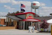 Workers leave the Tyson Foods pork processing plant in Logansport, Ind., May 7, 2020. Federal r ...