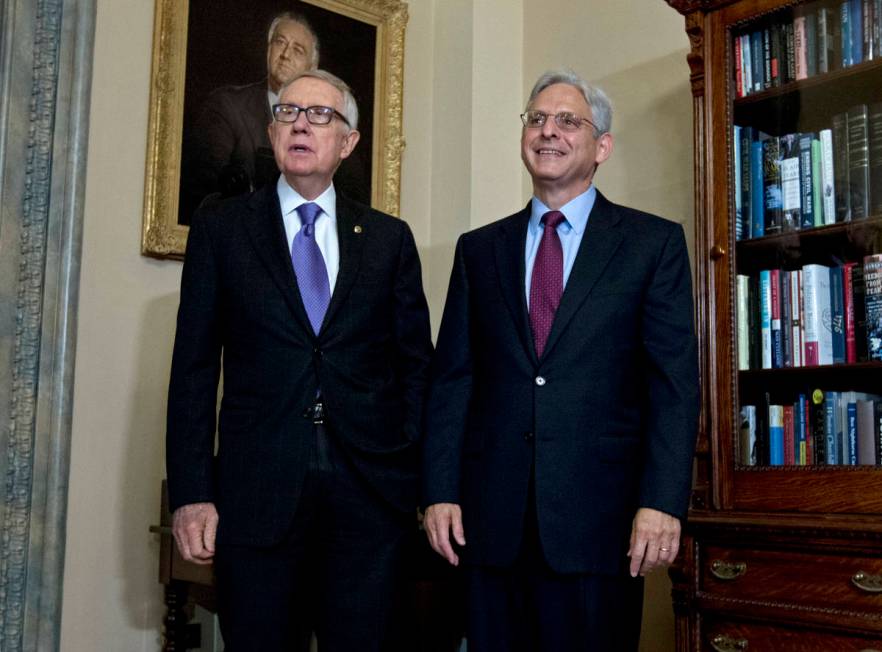 Senate Minority Leader Harry Reid of Nev., left, meets with Judge Merrick Garland, President Ba ...