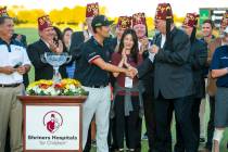 Kevin Na, center, shakes the hand of Imperial Potentate Jerry Gantt after winning the tournamen ...