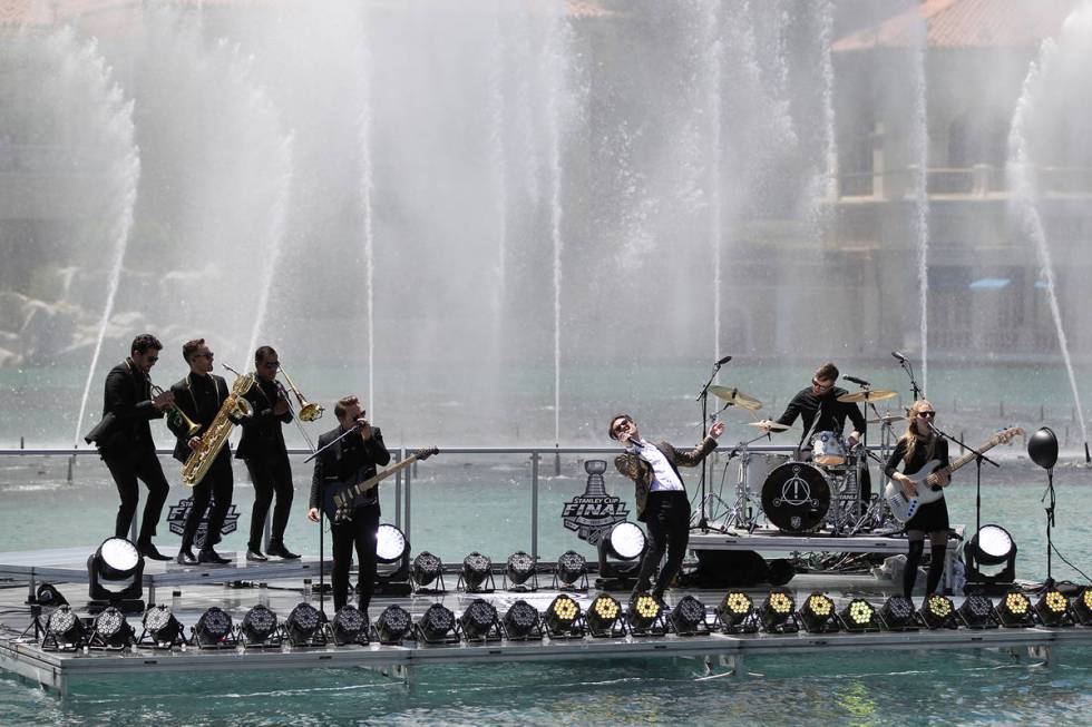 Frontman Brendon Urie, center, and members of the Las Vegas rock band Panic! at the Disco perfo ...