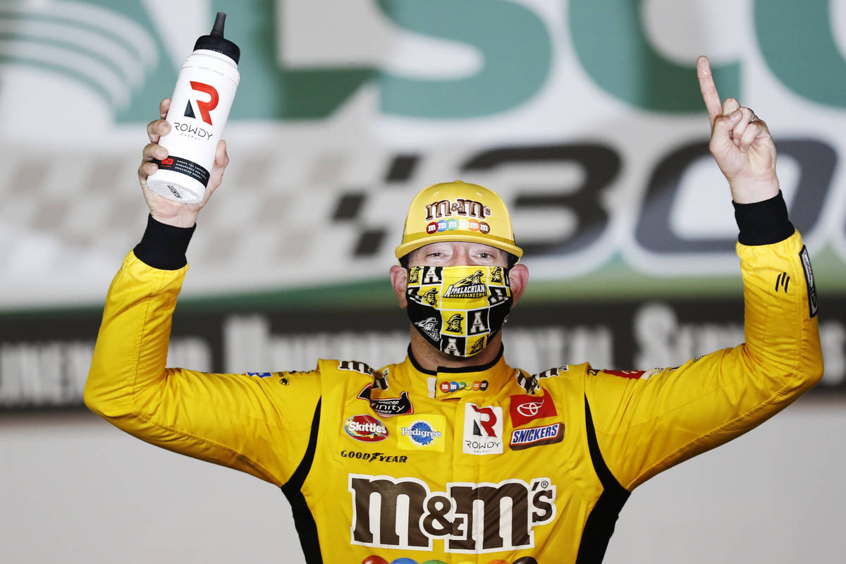 Kyle Busch (54) celebrates after winning the NASCAR Xfinity Series auto race at Charlotte Motor ...