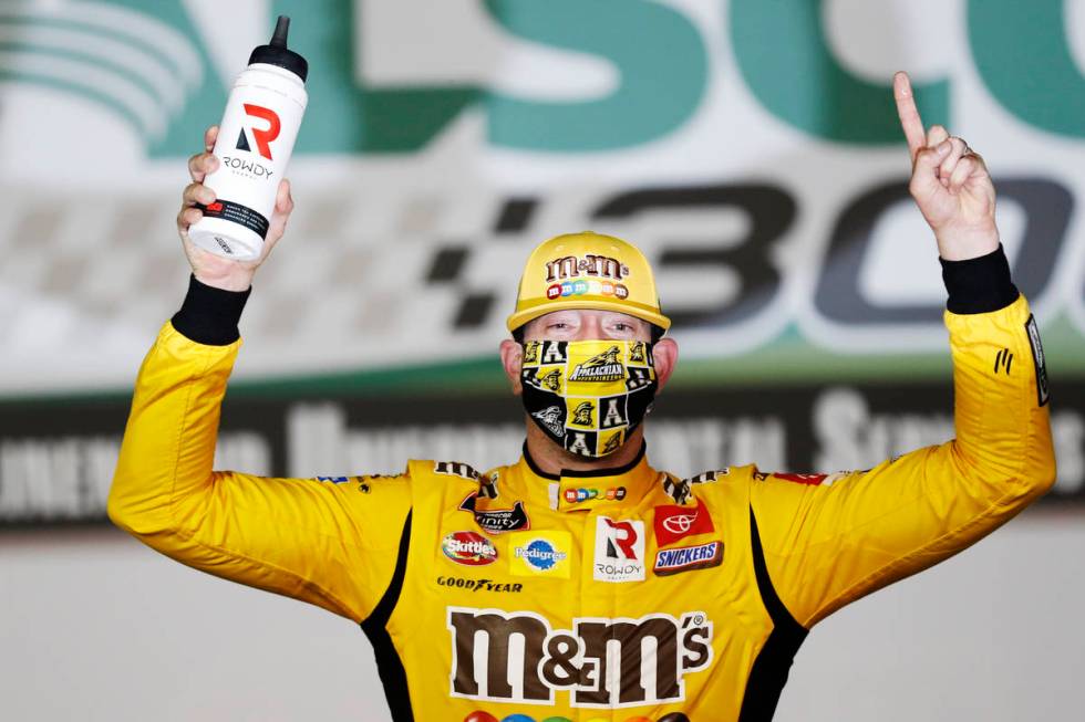 Kyle Busch (54) celebrates after winning the NASCAR Xfinity Series auto race at Charlotte Motor ...