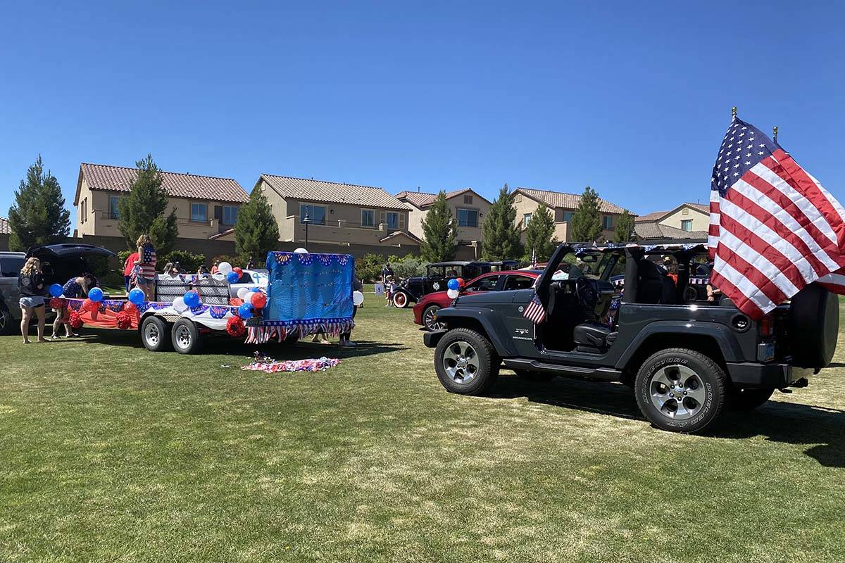 Cars line up to take part in Skye Canyon’s inaugural Patriotic Car Parade in northwest L ...