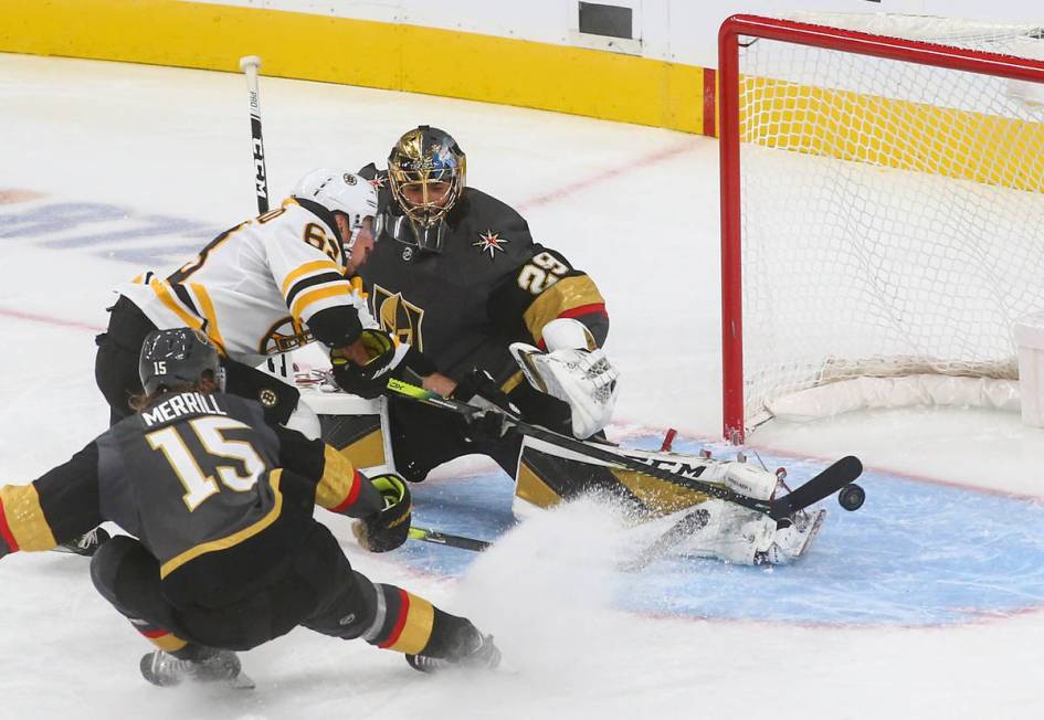 Golden Knights goaltender Marc-Andre Fleury (29) blocks a shot from Boston Bruins' Brad Marchan ...