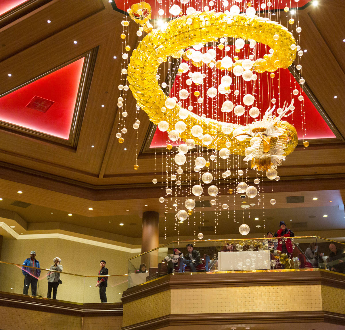 People take in the view from the second floor during the 1-year anniversary of the Lucky Dragon ...