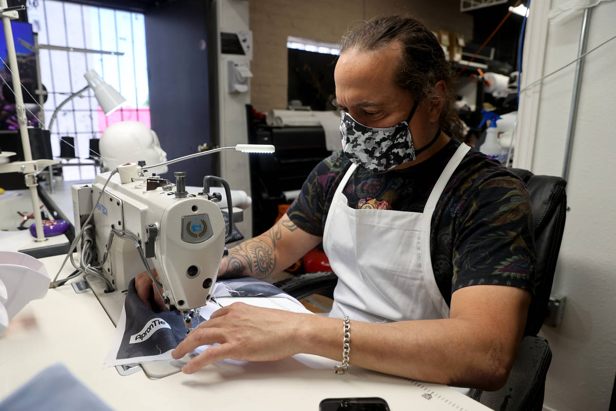 Former chef Jean Paul Labadie, creator of ApronTie, sews his product for chefs at his factory i ...