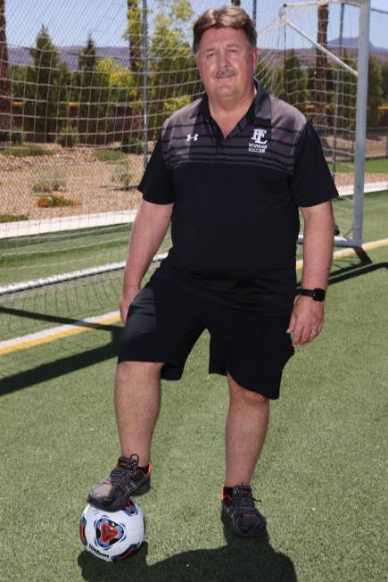 Bob Chinn, head coach of the Faith Lutheran girl's varsity team, poses for a photo at Faith Lut ...