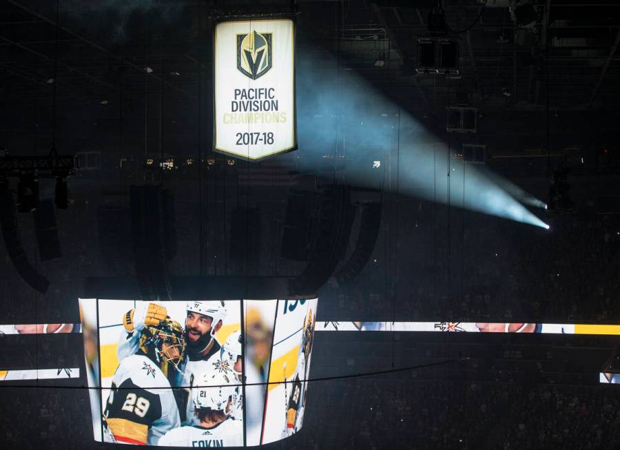 The West Coast Conference Champion and Pacific Division Champion banners are illuminated before ...