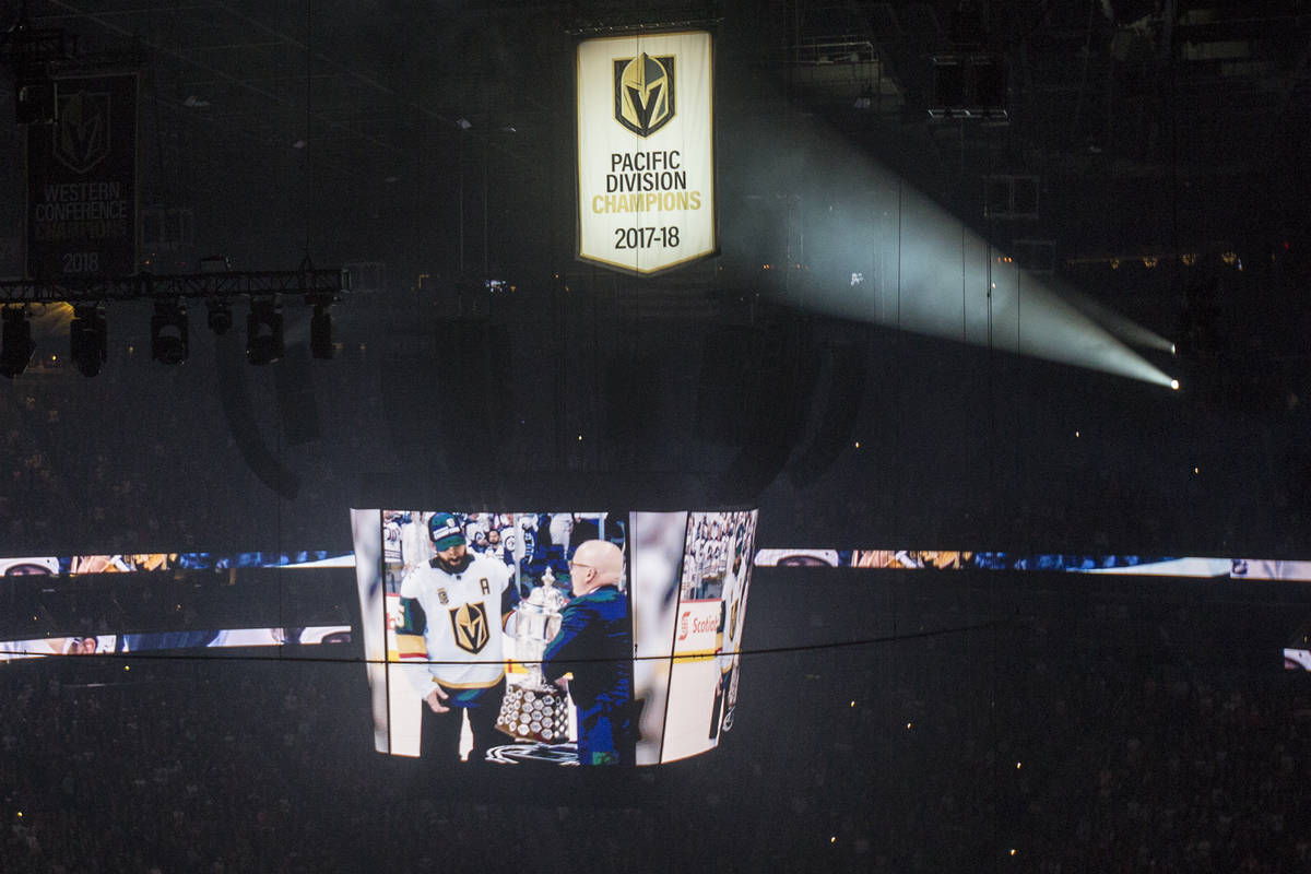 The West Coast Conference Champion and Pacific Division Champion banners are illuminated before ...