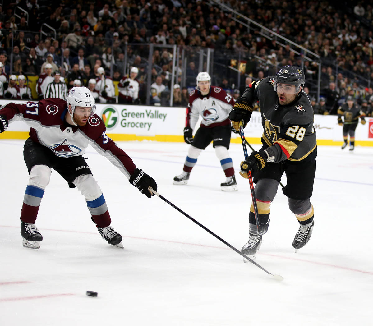 Vegas Golden Knights left wing William Carrier (28) shoots past Colorado Avalanche left wing J. ...