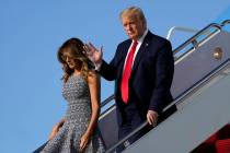 President Donald Trump and first lady Melania Trump arrive at Andrews Air Force Base, Md., Wedn ...